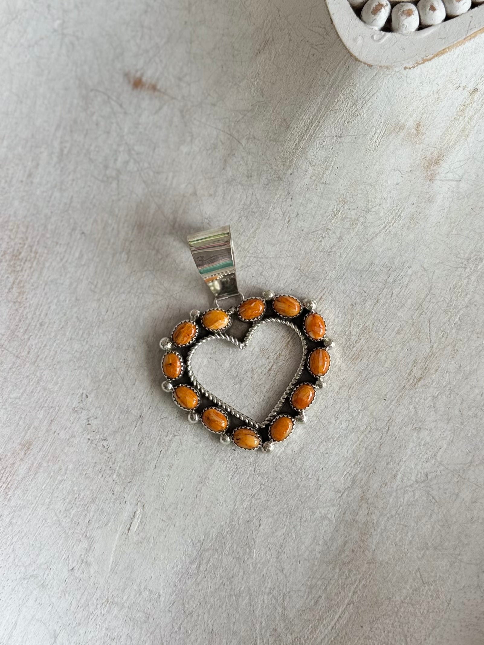 Orange spiny heart pendant