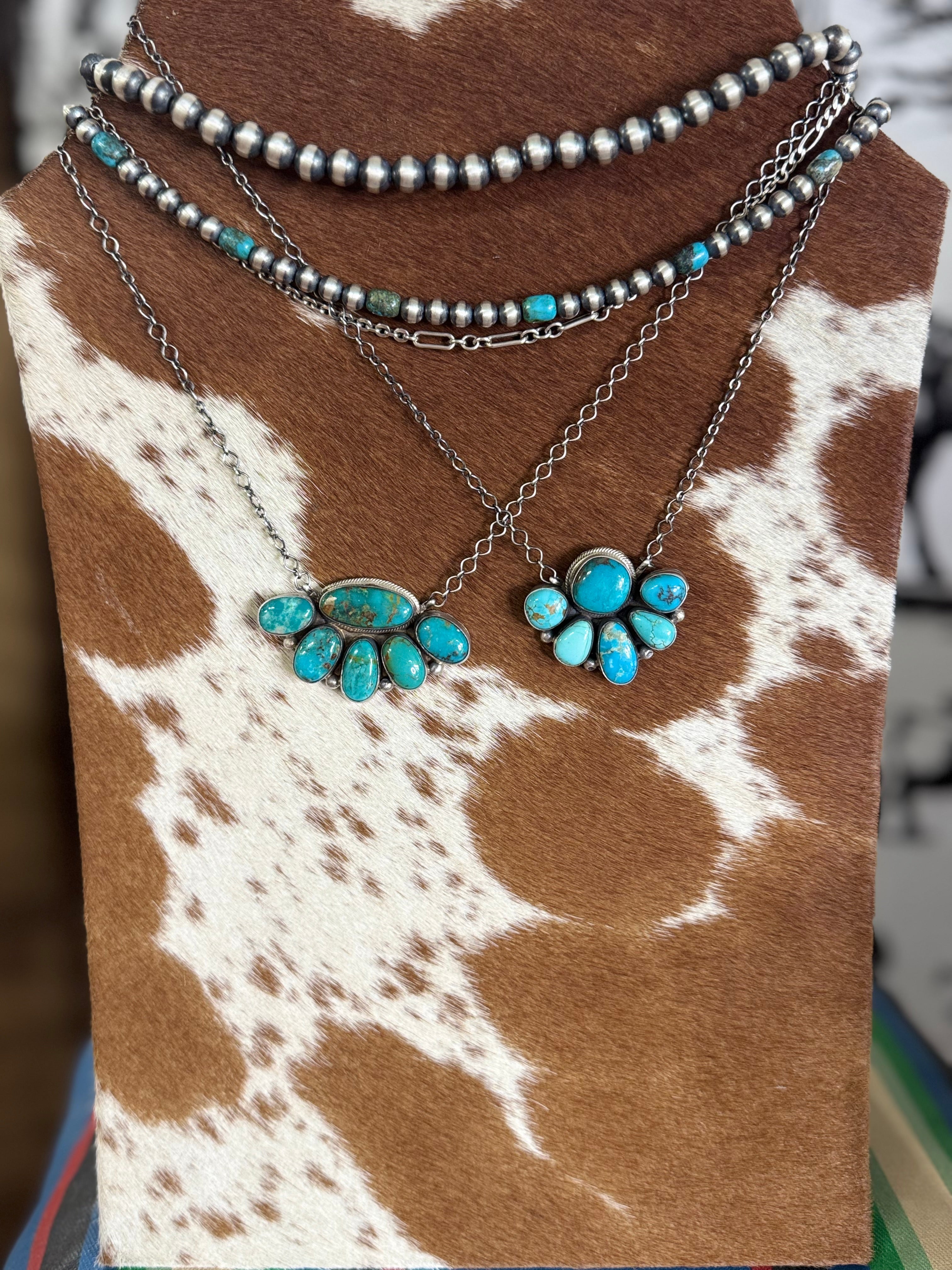 Half cluster necklaces